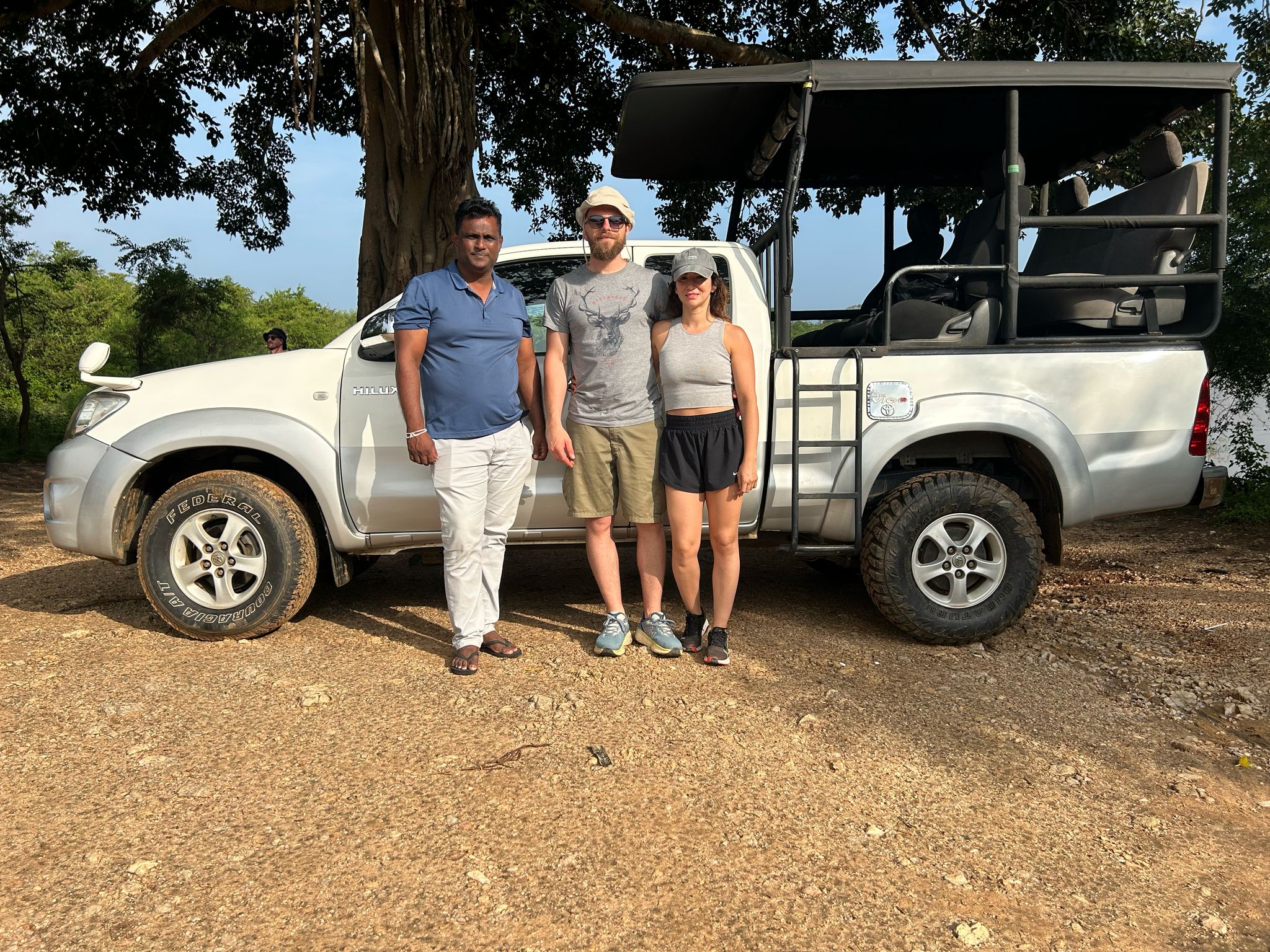 Guests with guide beside jeep
